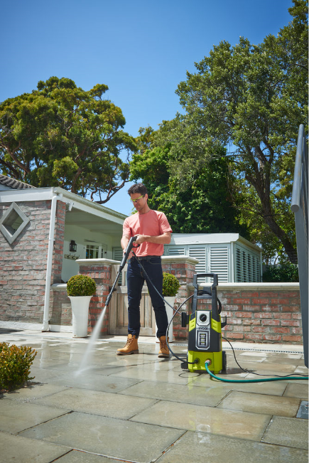 A man spraying paving